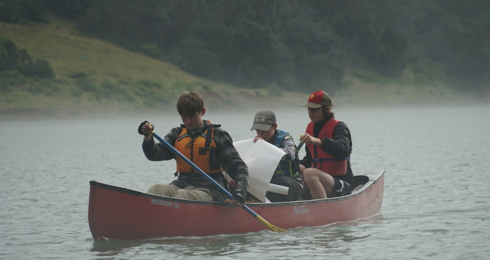 Scouts canoeing on a lake